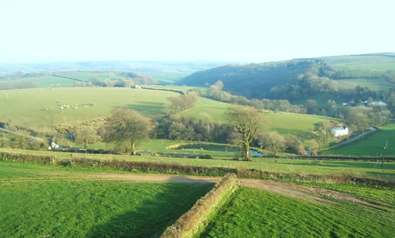 The view of the valley and pond at our Holiday Cottages in North Devon